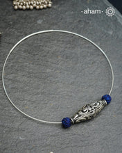 Everyday Wear Silver neckpiece in 92.5 silver in Wire Hasli with chitai bead and blue cotton balls. Easy to wear, looks great with Indian and Western outfits. The Hasli is easily openable and can be used with any other pendant as well.