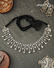 Graceful and intricately detailed, this handcrafted silver neckpiece crafted in 92.5 silver is designed to make a statement through its beautifully balanced composition. Delicate openwork, sculpted floral accents, and polished silver drops come together in a rhythmic pattern that lends the piece depth, texture, and movement.

Despite its striking appearance, the neckpiece is lightweight and comfortable to wear, making it an effortless choice for both everyday dressing and special occasions. 