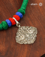 Show off your unique style with the Mewad Silver Neckpiece. A light weight pendant at the center with coloured thread, this neckpiece is sure to add a pop of colour to any outfit. Elevate your look and stand out from the crowd with this beautiful neckpiece.