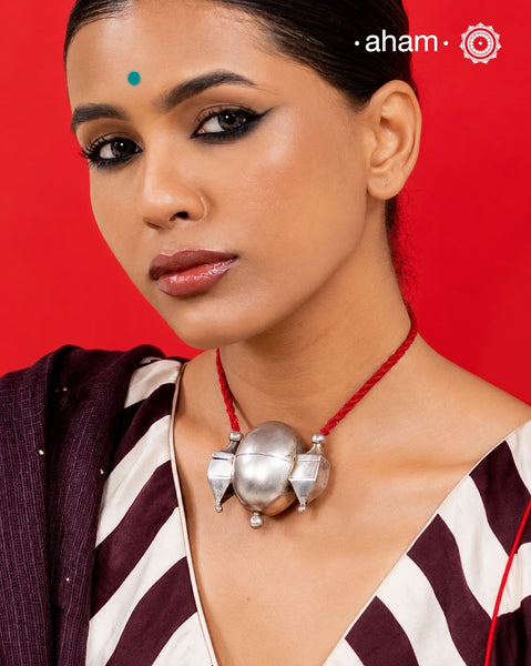 Traditional Shiva lingam neckpiece handcrafted in silver with an adjustable cotton thread.