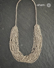 The Odhisa Dhaan Sarson Mala is a masterful vintage creation that embodies both heritage and symbolism.

Featuring multiple strands of delicately crafted rice- (Dhaan) and mustard- (Sarson) shaped silver beads, this neckpiece reflects the cultural traditions of the Kutia Kondh tribals of Odisha, for whom these forms represent prosperity, fertility, and abundance.