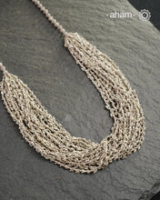 The Odhisa Dhaan Sarson Mala is a masterful vintage creation that embodies both heritage and symbolism.

Featuring multiple strands of delicately crafted rice- (Dhaan) and mustard- (Sarson) shaped silver beads, this neckpiece reflects the cultural traditions of the Kutia Kondh tribals of Odisha, for whom these forms represent prosperity, fertility, and abundance.