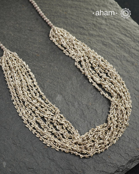 The Odhisa Dhaan Sarson Mala is a masterful vintage creation that embodies both heritage and symbolism.

Featuring multiple strands of delicately crafted rice- (Dhaan) and mustard- (Sarson) shaped silver beads, this neckpiece reflects the cultural traditions of the Kutia Kondh tribals of Odisha, for whom these forms represent prosperity, fertility, and abundance.