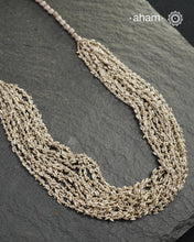 The Odhisa Dhaan Sarson Mala is a masterful vintage creation that embodies both heritage and symbolism.

Featuring multiple strands of delicately crafted rice- (Dhaan) and mustard- (Sarson) shaped silver beads, this neckpiece reflects the cultural traditions of the Kutia Kondh tribals of Odisha, for whom these forms represent prosperity, fertility, and abundance.
