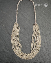 The Odhisa Dhaan Sarson Mala is a masterful vintage creation that embodies both heritage and symbolism.

Featuring multiple strands of delicately crafted rice- (Dhaan) and mustard- (Sarson) shaped silver beads, this neckpiece reflects the cultural traditions of the Kutia Kondh tribals of Odisha, for whom these forms represent prosperity, fertility, and abundance.