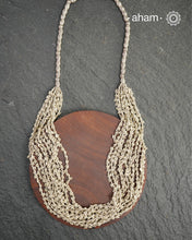 The Odhisa Dhaan Sarson Mala is a masterful vintage creation that embodies both heritage and symbolism.

Featuring multiple strands of delicately crafted rice- (Dhaan) and mustard- (Sarson) shaped silver beads, this neckpiece reflects the cultural traditions of the Kutia Kondh tribals of Odisha, for whom these forms represent prosperity, fertility, and abundance.