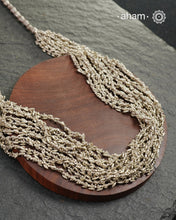 The Odhisa Dhaan Sarson Mala is a masterful vintage creation that embodies both heritage and symbolism.

Featuring multiple strands of delicately crafted rice- (Dhaan) and mustard- (Sarson) shaped silver beads, this neckpiece reflects the cultural traditions of the Kutia Kondh tribals of Odisha, for whom these forms represent prosperity, fertility, and abundance.