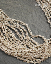 The Odhisa Dhaan Sarson Mala is a masterful vintage creation that embodies both heritage and symbolism.

Featuring multiple strands of delicately crafted rice- (Dhaan) and mustard- (Sarson) shaped silver beads, this neckpiece reflects the cultural traditions of the Kutia Kondh tribals of Odisha, for whom these forms represent prosperity, fertility, and abundance.