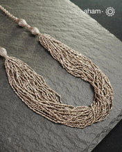 The Odhisa&nbsp;Sarson Mala&nbsp;is a masterful vintage creation that embodies both heritage and symbolism.

Featuring multiple strands of delicately crafted &nbsp;mustard/Sarson&nbsp;shaped silver beads, this neckpiece reflects the cultural traditions of the Kutia Kondh tribals of Odisha, for whom these forms represent prosperity, fertility, and abundance.

