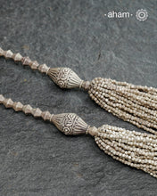 The Odhisa Sarson Mala is a masterful vintage creation that embodies both heritage and symbolism.Featuring multiple strands of delicately crafted mustard/Sarson shaped silver beads, this neckpiece reflects the cultural traditions of the Kutia Kondh tribals of Odisha, for whom these forms represent prosperity, fertility, and abundance.
