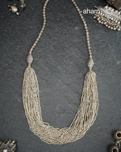 The Odhisa&nbsp;Sarson Mala is a masterful vintage creation that embodies both heritage and symbolism.Featuring multiple strands of delicately crafted &nbsp;mustard/Sarson shaped silver beads, this neckpiece reflects the cultural traditions of the Kutia Kondh tribals of Odisha, for whom these forms represent prosperity, fertility, and abundance.
