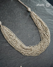 The Odhisa Sarson Mala is a masterful vintage creation that embodies both heritage and symbolism.Featuring multiple strands of delicately crafted mustard/Sarson shaped silver beads, this neckpiece reflects the cultural traditions of the Kutia Kondh tribals of Odisha, for whom these forms represent prosperity, fertility, and abundance.
