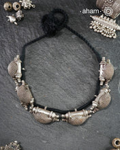 For those who enjoy and appreciate traditional tribal pieces, this one is for you. A beautiful statement neckpiece with chunky amulets threaded together on cotton string. A stunning piece this one is.