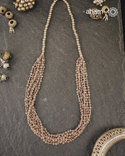 The Odhisa Dhaan Sarson Mala is a masterful vintage creation that embodies both heritage and symbolism.

Featuring multiple strands of delicately crafted rice- (Dhaan) and mustard- (Sarson) shaped silver beads, this neckpiece reflects the cultural traditions of the Kutia Kondh tribals of Odisha, for whom these forms represent prosperity, fertility, and abundance.

