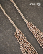 The Odhisa Dhaan Sarson Mala is a masterful vintage creation that embodies both heritage and symbolism.

Featuring multiple strands of delicately crafted rice- (Dhaan) and mustard- (Sarson) shaped silver beads, this neckpiece reflects the cultural traditions of the Kutia Kondh tribals of Odisha, for whom these forms represent prosperity, fertility, and abundance.
