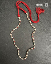 Silver Dholki/ Wax Beads coated with silver foil with Maroon adjustable thread. Also known as Bor Mala