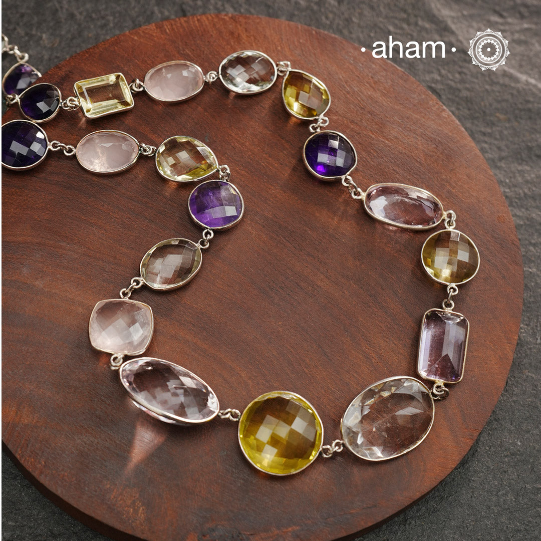 Silver Neckpiece with Semi Precious Stones in 92.5 silver bezel setting and gold polish.Works great with work wear or even your evening dress.