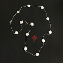 Long Silver mother of pearl neckpiece. Wear it long or double it up.  Works great with work wear or even your evening dress.