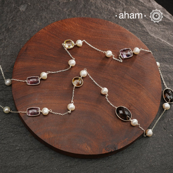 Silver Neckpiece with Semi Precious Stones in bezel setting and pearls. 
Works great with work wear or even your evening dress.