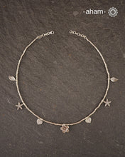 Stunning silver neckpiece with little charms. All crafted in 92.5 silver.&nbsp;
Works great with work wear or even your evening dress.