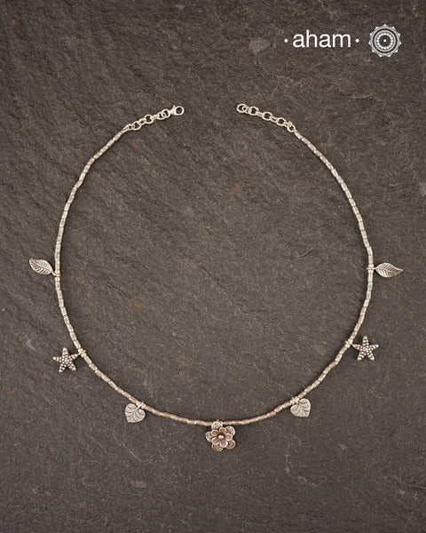 Stunning silver neckpiece with little charms. All crafted in 92.5 silver.&nbsp;
Works great with work wear or even your evening dress.