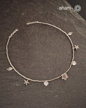 Stunning silver neckpiece with little charms. All crafted in 92.5 silver.&nbsp;
Works great with work wear or even your evening dress.