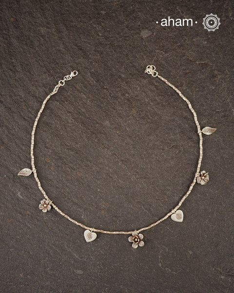 Stunning silver neckpiece with little charms. All crafted in 92.5 silver.&nbsp;
Works great with work wear or even your evening dress.