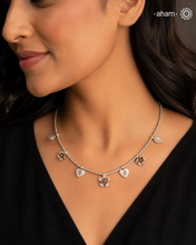 Stunning silver neckpiece with little charms. All crafted in 92.5 silver.&nbsp;
Works great with work wear or even your evening dress.