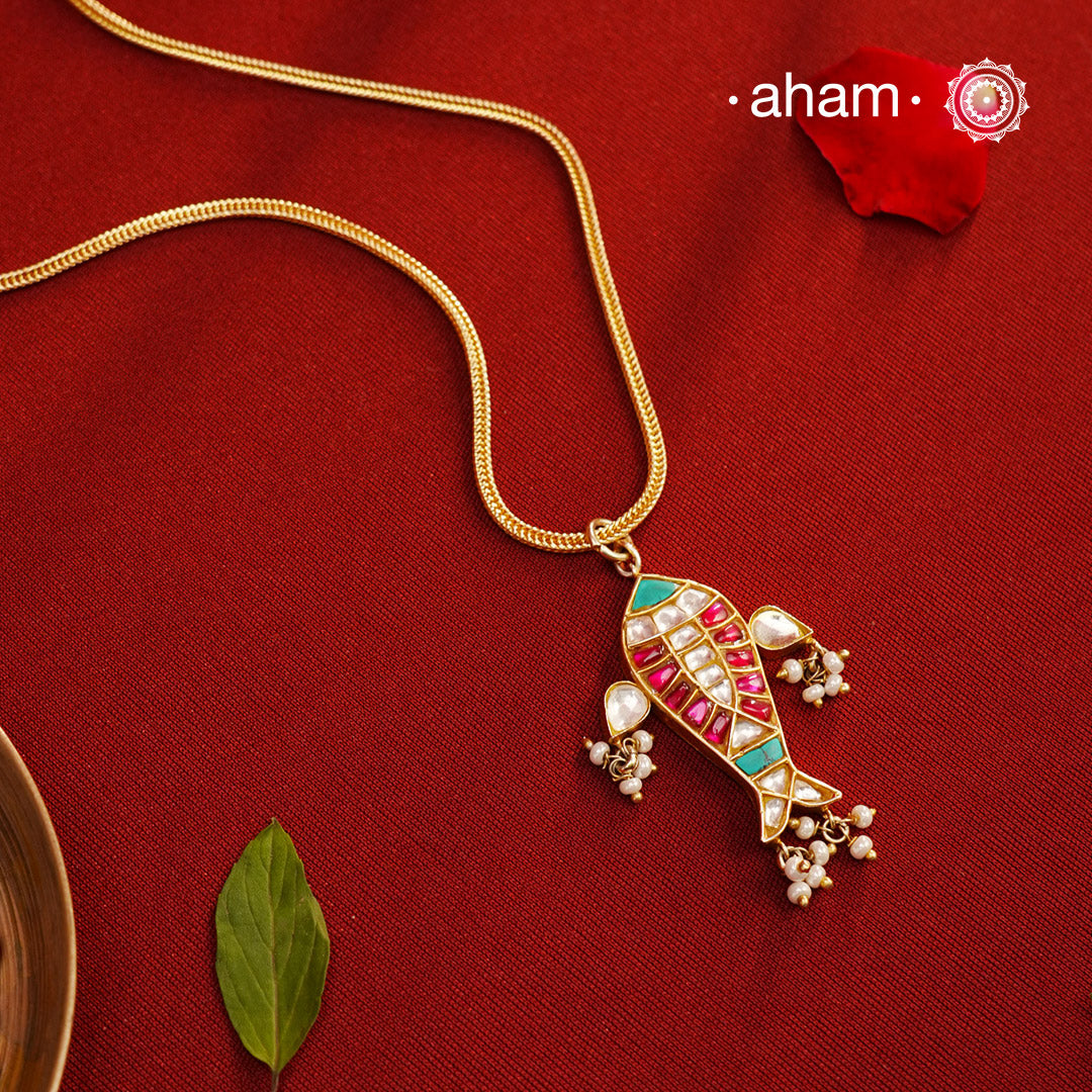 This stunning Neckpiece features a delicate 92.5 silver chain with a beautifully crafted gold polished matsya fish pendant. Add a touch of elegance to your look with this unique and timeless piece.