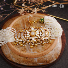 Embrace the allure of timeless elegance with Aham Jewellery’s latest Mother of Pearl collection, a radiant choice for festive celebrations and weddings.

The choker is crafted in 92.5 silver and adorned with a luxurious gold polish, capturing the iridescent beauty of mother of pearl.