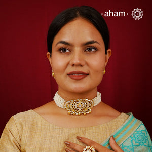 Embrace the allure of timeless elegance with Aham Jewellery’s latest Mother of Pearl collection, a radiant choice for festive celebrations and weddings.

The choker is crafted in 92.5 silver and adorned with a luxurious gold polish, capturing the iridescent beauty of mother of pearl.