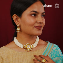 Embrace the allure of timeless elegance with Aham Jewellery’s latest Mother of Pearl collection, a radiant choice for festive celebrations and weddings.

The Neckpiece is crafted in 92.5 silver and adorned with a luxurious gold polish, capturing the iridescent beauty of mother of pearl. You can wear this versatile piece like a choker or a around the neck piece. 
