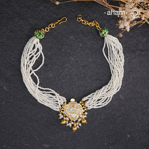 Embrace the allure of timeless elegance with Aham Jewellery’s latest Mother of Pearl collection, a radiant choice for festive celebrations and weddings.

The Neckpiece is crafted in 92.5 silver and adorned with a luxurious gold polish, capturing the iridescent beauty of mother of pearl. You can wear this versatile piece like a choker or also below the neck.