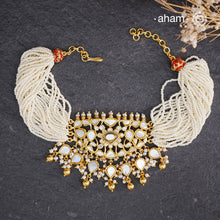 Embrace the allure of timeless elegance with Aham Jewellery’s latest Mother of Pearl collection, a radiant choice for festive celebrations and weddings.

The choker is crafted in 92.5 silver and adorned with a luxurious gold polish, capturing the iridescent beauty of mother of pearl. You can wear this versatile piece like a choker or a around the neck piece.