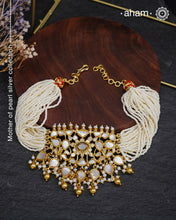 Embrace the allure of timeless elegance with Aham Jewellery’s latest Mother of Pearl collection, a radiant choice for festive celebrations and weddings.

The choker is crafted in 92.5 silver and adorned with a luxurious gold polish, capturing the iridescent beauty of mother of pearl. You can wear this versatile piece like a choker or a around the neck piece.