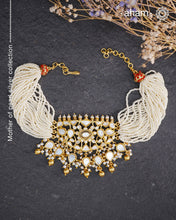 Embrace the allure of timeless elegance with Aham Jewellery’s latest Mother of Pearl collection, a radiant choice for festive celebrations and weddings.

The choker is crafted in 92.5 silver and adorned with a luxurious gold polish, capturing the iridescent beauty of mother of pearl. You can wear this versatile piece like a choker or a around the neck piece.