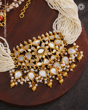 Embrace the allure of timeless elegance with Aham Jewellery’s latest Mother of Pearl collection, a radiant choice for festive celebrations and weddings.

The choker is crafted in 92.5 silver and adorned with a luxurious gold polish, capturing the iridescent beauty of mother of pearl. You can wear this versatile piece like a choker or a around the neck piece.