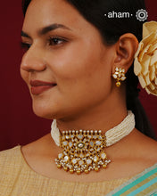 Embrace the allure of timeless elegance with Aham Jewellery’s latest Mother of Pearl collection, a radiant choice for festive celebrations and weddings.

The choker is crafted in 92.5 silver and adorned with a luxurious gold polish, capturing the iridescent beauty of mother of pearl. You can wear this versatile piece like a choker or a around the neck piece.