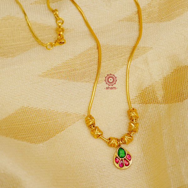 This exquisite silver necklace dipped in gold is handcrafted with gorgeous kundan work. Its lightweight design makes it perfect for family events and festivities.  