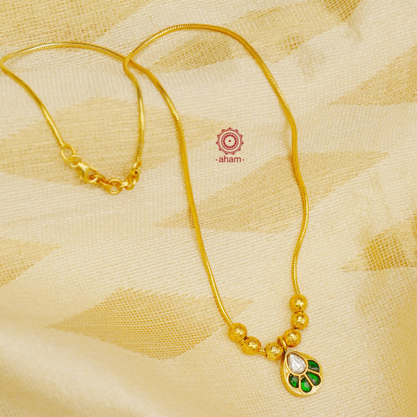 This exquisite silver necklace dipped in gold is handcrafted with gorgeous kundan work. Its lightweight design makes it perfect for family events and festivities.  