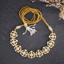 Embrace the allure of timeless elegance with Aham Jewellery’s latest Mother of Pearl collection, a radiant choice for festive celebrations and weddings.

The neckpiece is crafted in 92.5 silver and adorned with a luxurious gold polish, capturing the iridescent beauty of mother of pearl. You can wear this versatile piece like a choker or below the neck and even as a mathapati.