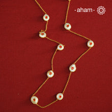 This handcrafted silver neckpiece features exquisite mother of pearl and intricate kundan inlay work, enhanced with a refined gold polish. Designed for versatility, it can be worn as a single long line or doubled for a layered look, making it a sophisticated addition to any jewellery collection.