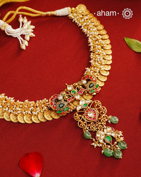 The classic kasu mala - coin neckpiece that never goes out of style. Crafted in 92.5 silver with gold polish. Exquisitely elegant, the heritage collection features traditional motifs and intricate&nbsp; workmanship on gold-plated silver jewellery, a reflection of the rich culture of India. This collection is perfect for brides and bridesmaids.