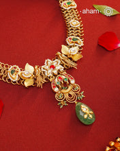 This hand made neckpiece is a modern twist on traditional designs. Crafted with 92.5 silver and adorned with stunning kundan work, its gold polish adds a touch of elegance. The beautiful green drop completes the look, showcasing expert traditional craftsmanship.