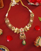 This hand made neckpiece is a modern twist on traditional designs. Crafted with 92.5 silver and adorned with stunning kundan work, its gold polish adds a touch of elegance. The beautiful green drop completes the look, showcasing expert traditional craftsmanship.