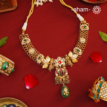 This hand made neckpiece is a modern twist on traditional designs. Crafted with 92.5 silver and adorned with stunning kundan work, its gold polish adds a touch of elegance. The beautiful green drop completes the look, showcasing expert traditional craftsmanship.