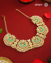 Elevate your festive look with this exquisite Pearl &amp; Turquoise Gold Polish Silver Neckpiece. Crafted in 92.5% silver with a delicate gold polish, its chand-shaped design beautifully blends vibrant turquoise and lustrous pearls. Ideal for mehandi, haldi ceremonies, or a friend’s wedding, this piece adds a touch of elegance and tradition to your ensemble. Make every celebration memorable with this stunning accessory.