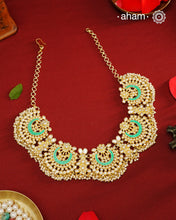 Elevate your festive look with this exquisite Pearl &amp; Turquoise Gold Polish Silver Neckpiece. Crafted in 92.5% silver with a delicate gold polish, its chand-shaped design beautifully blends vibrant turquoise and lustrous pearls. Ideal for mehandi, haldi ceremonies, or a friend’s wedding, this piece adds a touch of elegance and tradition to your ensemble. Make every celebration memorable with this stunning accessory.
