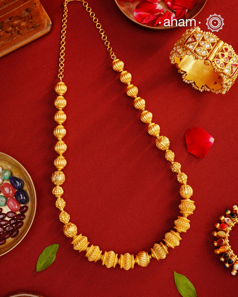 Beautiful silver beaded mala with gold polish. Light weight and very versatile to wear with your Indian clothes.