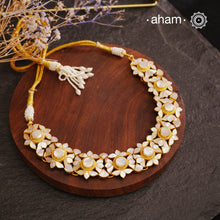 Embrace the allure of timeless elegance with Aham Jewellery’s latest Mother of Pearl collection, a radiant choice for festive celebrations and weddings.

The Neckpiece is crafted in 92.5 silver and adorned with a luxurious gold polish, capturing the iridescent beauty of mother of pearl. You can wear this versatile piece like a choker or a around the neck piece.